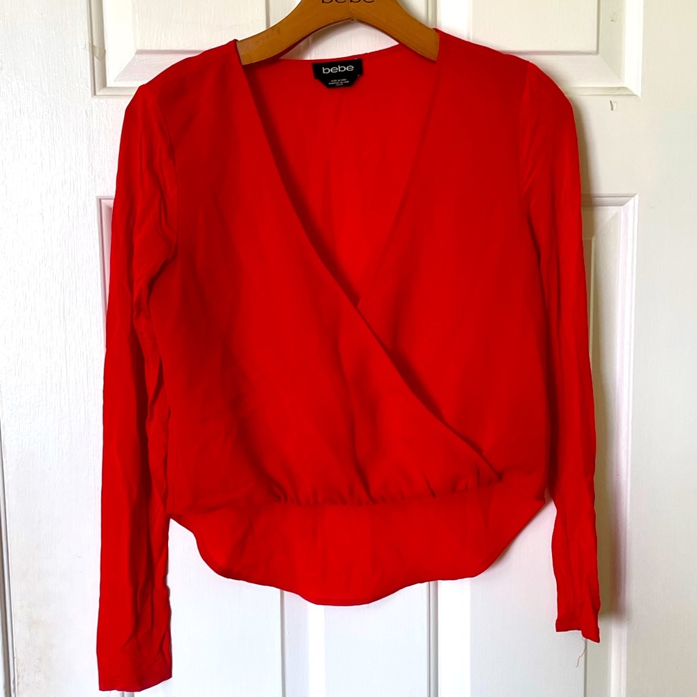 Bebe cropped long sleeve mock wrap shirt.